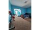 Bright bedroom with a large bed, exercise bike, and sunny alcove at 2132 Royal Berry Ct, Cary, NC 27511
