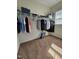Walk-in closet with carpet, shelving, and clothes at 2132 Royal Berry Ct, Cary, NC 27511