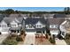 Two story home featuring solar panels, an attached garage, and manicured landscaping at 2132 Royal Berry Ct, Cary, NC 27511
