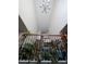 Foyer with railing, staircase, tall ceilings, and indoor plants at 2132 Royal Berry Ct, Cary, NC 27511