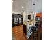 Kitchen with stainless steel appliances, a breakfast bar with seating, and dark wood cabinets at 2132 Royal Berry Ct, Cary, NC 27511