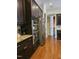 Kitchen features stainless steel appliances, granite countertops, hardwood flooring, and dark cabinets at 2132 Royal Berry Ct, Cary, NC 27511
