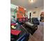 Comfortable living area featuring leather seating and warm, inviting colors at 2132 Royal Berry Ct, Cary, NC 27511