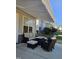 Comfortable patio seating area featuring cushioned furniture and a retractable awning for shade at 2132 Royal Berry Ct, Cary, NC 27511