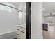 Bathroom features a shower and tub combination, mirror, and cabinet at 226 Woodsborough Pl, Raleigh, NC 27601