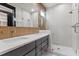Modern bathroom with double vanity, quartz countertop, matte black hardware, and glass shower enclosure at 226 Woodsborough Pl, Raleigh, NC 27601