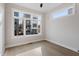 Bright bedroom featuring a large window that provides neighborhood views at 226 Woodsborough Pl, Raleigh, NC 27601