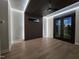 Modern bedroom featuring unique lighting, a ceiling fan, and access to outdoor space at 226 Woodsborough Pl, Raleigh, NC 27601