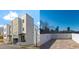 Modern gray townhome exteriors feature sleek designs, covered entrances, and private rooftop decks at 226 Woodsborough Pl, Raleigh, NC 27601