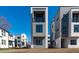 Contemporary multi-story gray townhomes feature modern architectural details and large windows at 226 Woodsborough Pl, Raleigh, NC 27601