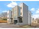 Stylish gray townhomes with clean lines, covered entries, and a modern aesthetic in the neighborhood at 226 Woodsborough Pl, Raleigh, NC 27601
