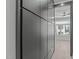 Hallway featuring large black storage cabinets with minimalist hardware at 226 Woodsborough Pl, Raleigh, NC 27601