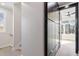 Hallway with a large closet with a ceiling fan and window at the end of the hall at 226 Woodsborough Pl, Raleigh, NC 27601