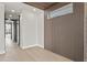 Bright hallway features modern wood accents and light hardwood floors, leading to a well-lit living space at 226 Woodsborough Pl, Raleigh, NC 27601