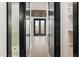 Hallway with a view into the bathroom on the left and a bedroom or closet on the right at 226 Woodsborough Pl, Raleigh, NC 27601