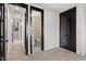 Hallway with open doors leads to a bathroom and a bedroom with a large closet; the hall opens to stairs at 226 Woodsborough Pl, Raleigh, NC 27601
