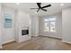 Spacious living room features a modern fireplace, large windows, and sleek hardwood floors, perfect for entertaining at 226 Woodsborough Pl, Raleigh, NC 27601