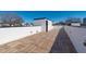 An outdoor rooftop deck with wood tiles, white walls, and black trim at 226 Woodsborough Pl, Raleigh, NC 27601