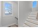 Staircase with underneath lighting leading to the next floor with a window at 226 Woodsborough Pl, Raleigh, NC 27601