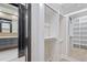Open walk-in closet with custom shelving, drawers, and a full-length mirror, adding a touch of elegance at 226 Woodsborough Pl, Raleigh, NC 27601