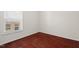 Bedroom featuring hardwood floors, neutral paint, and a bright window at 23 Juliette Dr, Durham, NC 27713
