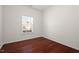 This bedroom features beautiful hardwood floors and a bright window at 23 Juliette Dr, Durham, NC 27713