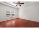 Spacious primary bedroom with a tray ceiling and natural light at 23 Juliette Dr, Durham, NC 27713