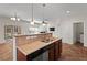 Kitchen with granite counters and stainless steel dishwasher connects to adjacent living spaces at 23 Juliette Dr, Durham, NC 27713