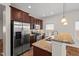 Well-lit kitchen features stainless steel appliances, granite countertops, and recessed lighting at 23 Juliette Dr, Durham, NC 27713