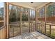 Charming screened-in porch with scenic backyard views, offering a tranquil outdoor living area at 23 Juliette Dr, Durham, NC 27713