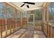 Inviting screened-in porch with views of a fenced backyard with mature trees, great for relaxing at 23 Juliette Dr, Durham, NC 27713