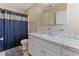 Bathroom with white vanity, marble countertops, and framed mirror at 2425 Shreve Rd, Rocky Mount, NC 27801
