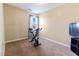 Spare room equipped with a workout bike and natural light at 2425 Shreve Rd, Rocky Mount, NC 27801