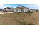A cozy, one-story house featuring a charming front porch with seating and manicured landscaping at 2425 Shreve Rd, Rocky Mount, NC 27801