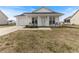 Charming single-story home with white siding, front porch, and well-maintained lawn at 2425 Shreve Rd, Rocky Mount, NC 27801