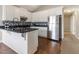 Well-lit kitchen featuring white cabinets, stainless steel appliances, and dark countertops at 2425 Shreve Rd, Rocky Mount, NC 27801