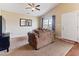 Comfortable living room featuring neutral carpet, ceiling fan, and cozy furniture at 2425 Shreve Rd, Rocky Mount, NC 27801