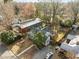 Aerial view of the house, highlighting the mature trees, back deck, and charming neighborhood at 2511 State St, Durham, NC 27704