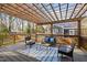 Inviting outdoor deck with comfortable seating under a pergola, perfect for relaxing and entertaining at 2511 State St, Durham, NC 27704