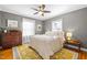 Inviting bedroom with neutral tones, a comfortable bed, and plenty of natural light creates a serene and cozy retreat at 2511 State St, Durham, NC 27704