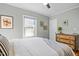 Inviting bedroom with a wooden dresser, soft bedding, and stylish decor creates a peaceful and comfortable retreat at 2511 State St, Durham, NC 27704