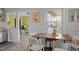 Cozy dining area with neutral decor, wood table, and natural light at 2511 State St, Durham, NC 27704