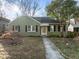 Charming one-story home with a well-maintained lawn and inviting walkway to the front door at 2511 State St, Durham, NC 27704