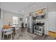 Well-lit kitchen and dining area with stainless steel appliances and classic charm at 2511 State St, Durham, NC 27704