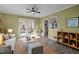 Sunlit living room featuring an open layout, access to a patio, and stylish decor at 2511 State St, Durham, NC 27704