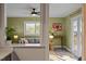 Inviting living room with a comfortable sofa, large windows, and seamless transition to the outdoor patio at 2511 State St, Durham, NC 27704
