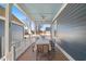 Inviting back porch with a ceiling fan and wood table set for outdoor dining and enjoying backyard views at 27 Ellen Cir, Clayton, NC 27527