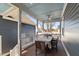 Inviting back porch with a ceiling fan and wood table set for outdoor dining and enjoying backyard views at 27 Ellen Cir, Clayton, NC 27527