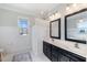 Bright bathroom offers a double vanity, sleek mirrors, and a shower with elegant fixtures at 27 Ellen Cir, Clayton, NC 27527