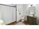 Bathroom featuring white tile walls, toilet, vanity and walk-in shower at 27 Ellen Cir, Clayton, NC 27527